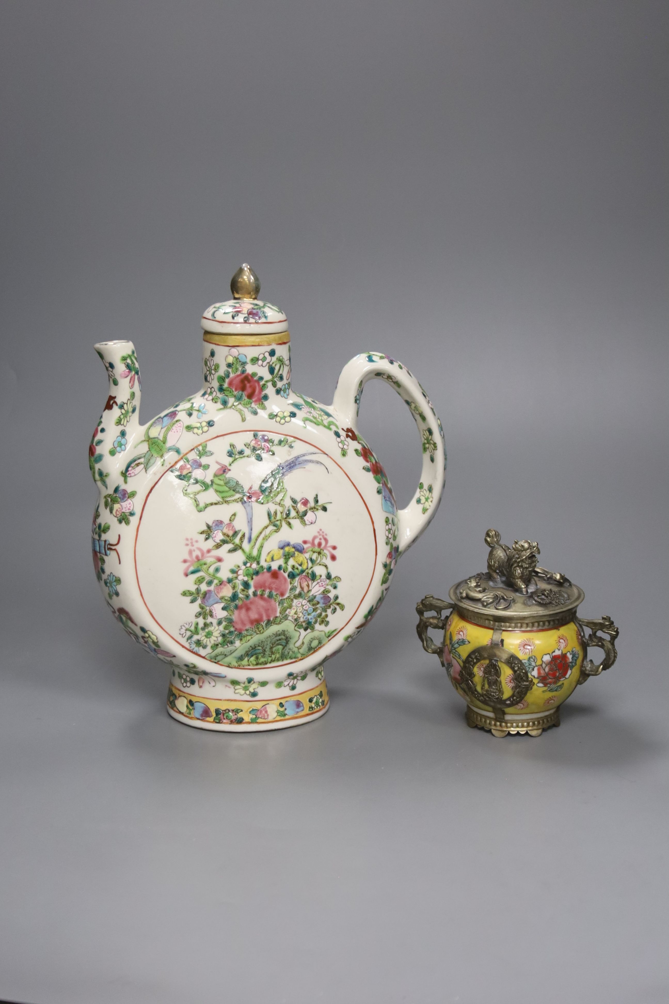 A Chinese famille rose wine ewer, 26cm high and a white metal mounted porcelain jar, 11cm high